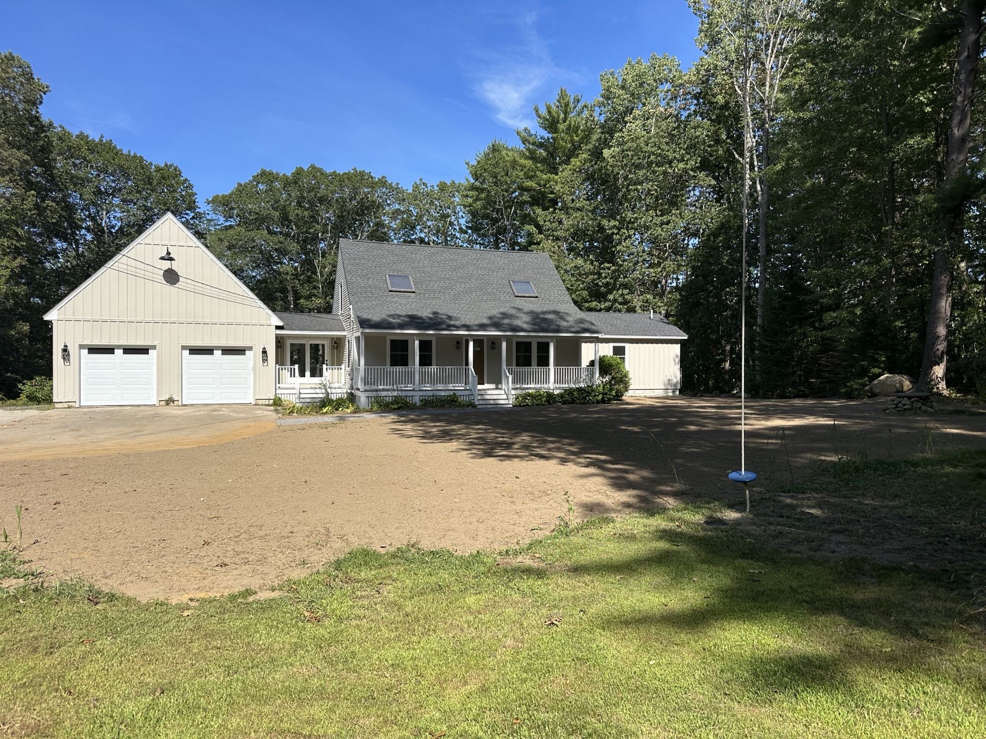 Cape-style home with a farmer's porch, built by Nova Building Co
